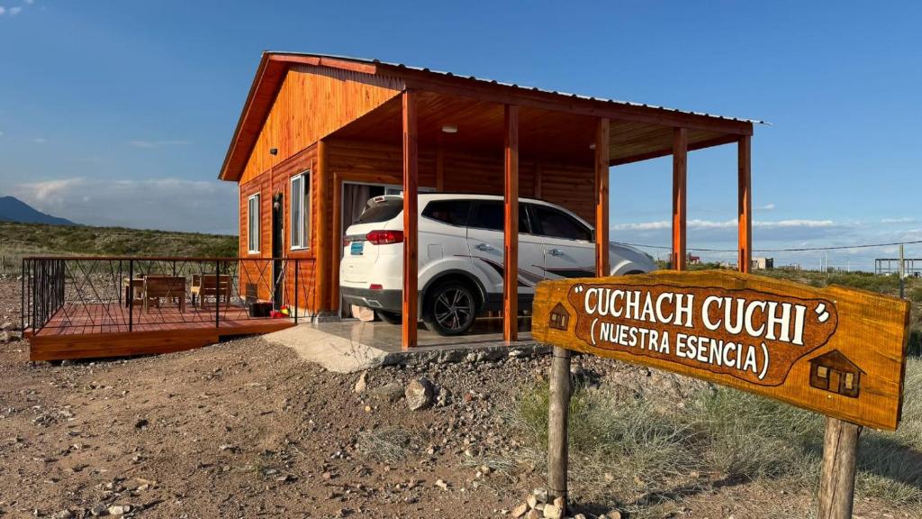a car parked in a small building with a sign at Cuchac Cuchic in Las Compuertas