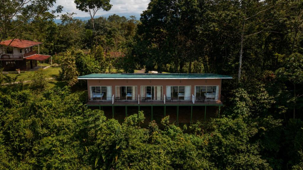 a house with a blue roof in the trees at Villas Josipek in Fortuna