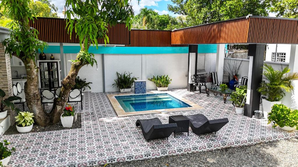 a swimming pool in the backyard of a house at Villa Donatella Bonao in Bonao