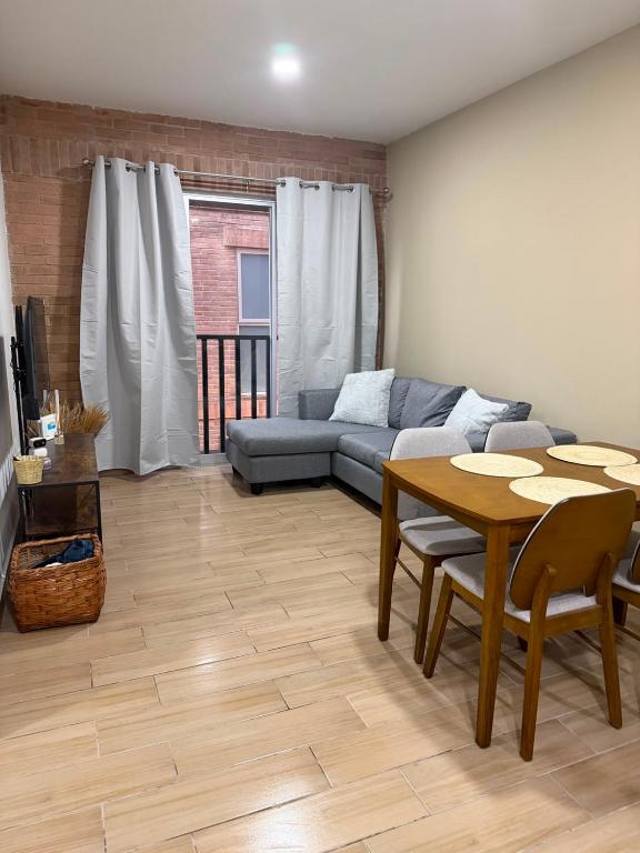 a living room with a couch and a table at Casa Zaabi in Oaxaca City