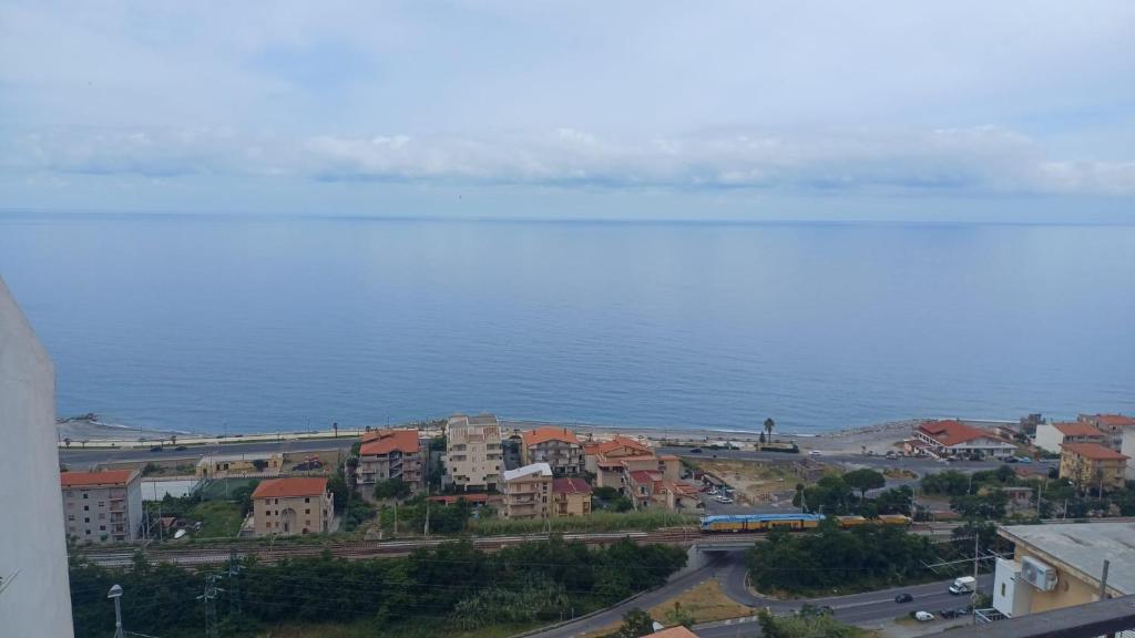 an aerial view of a city and the ocean at B&B Yle in Cetraro