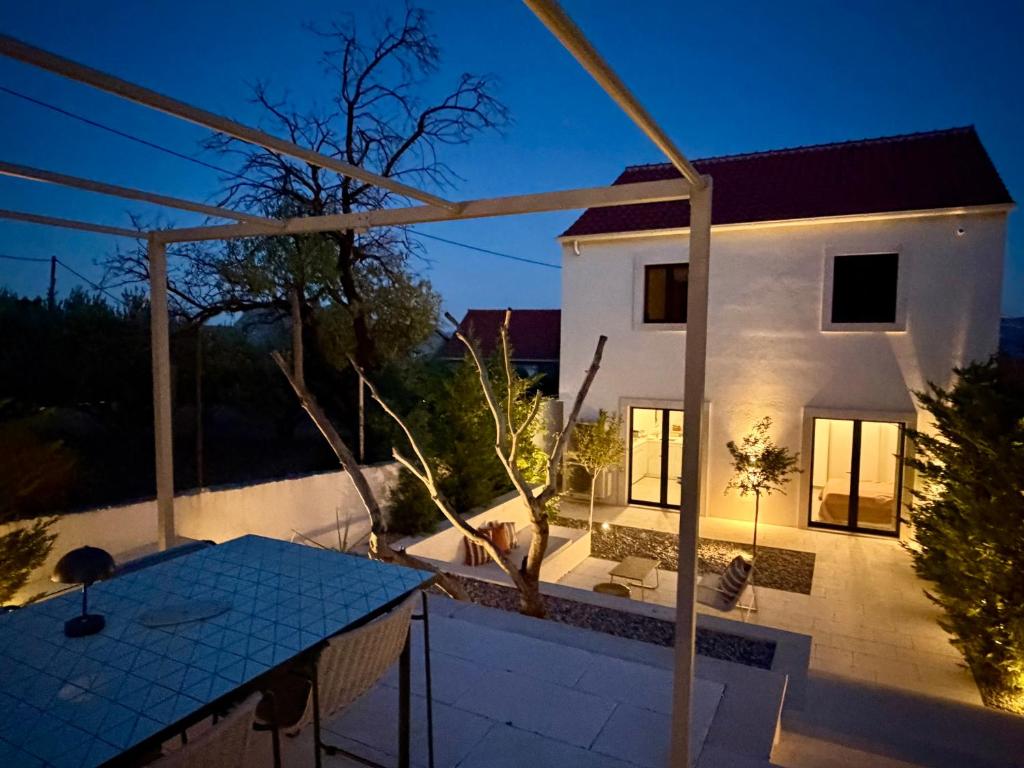 a view of a house from the balcony at night at Casa Bol Old Town in Bol