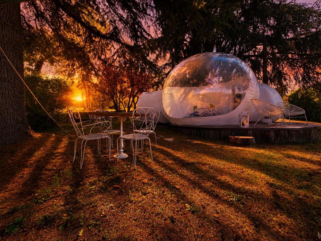 a tent with chairs and a table in the grass at FUGA ROMANTICA - Panoramica in Almese