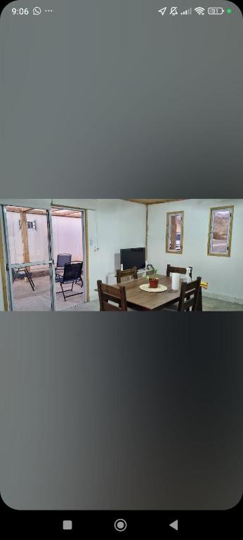 a view of a living room with a table and chairs at Complejo El Mirador in Calingasta