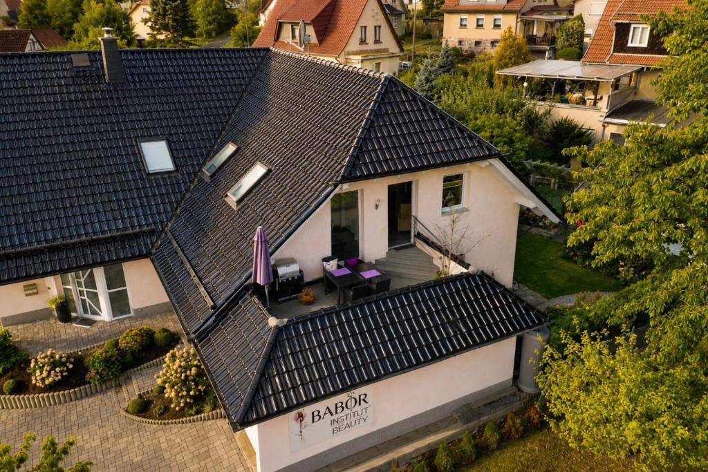 an overhead view of a house with a black roof at Lifestyle in Kurort Steinbach-Hallenberg