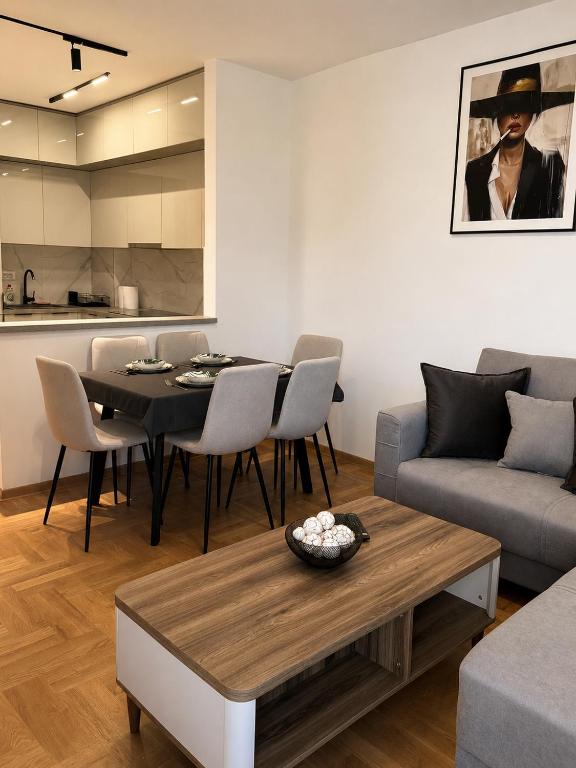 a living room with a table and a couch at apartment Danijela in Radanovići