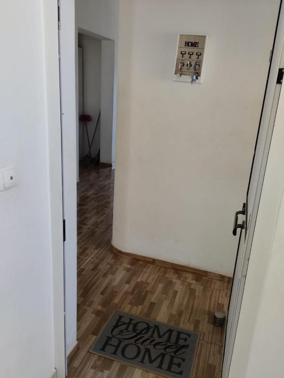 a hallway with a door and a home home home home home home home home home at Comfortable 2-Bedroom Apartment, Monte Sossego in Mindelo