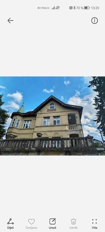 a picture of a building with a sky at Tinohovska vila in Hadžići