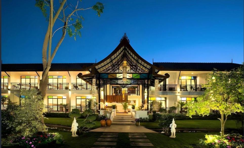 a large building with a gazebo in the yard at Radateeree Boutique Resort in Chiang Mai
