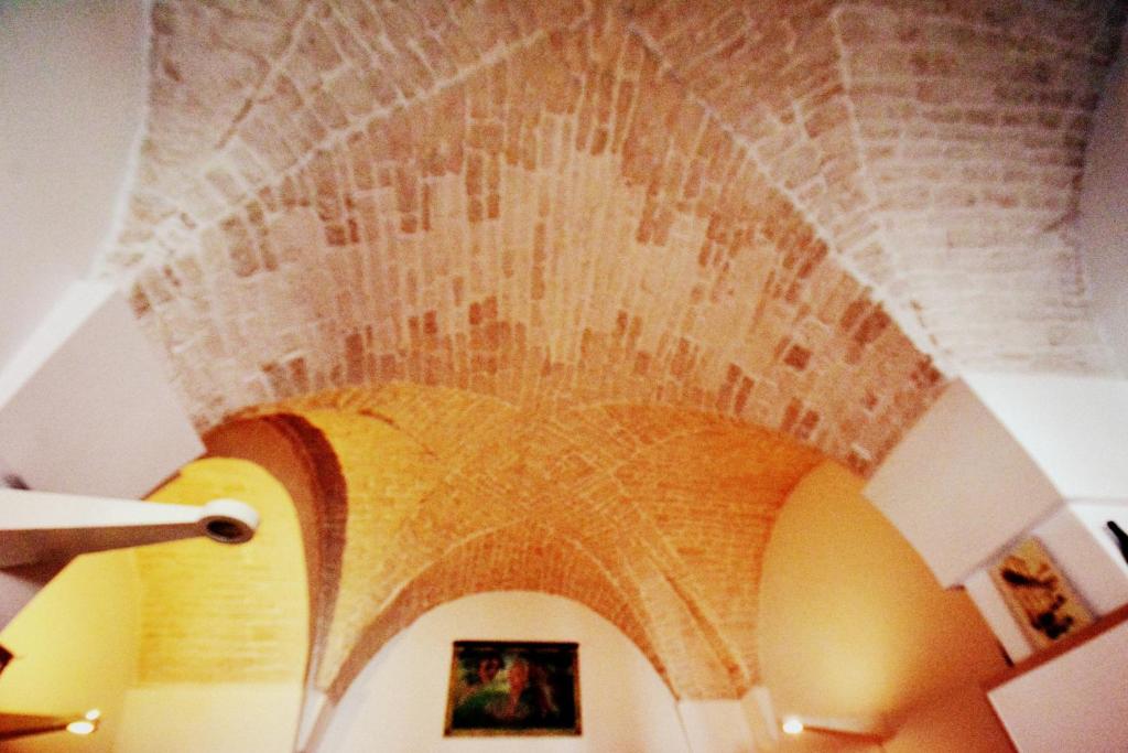 an archway with a brick ceiling in a building at Ciao Bello B&B in Martina Franca