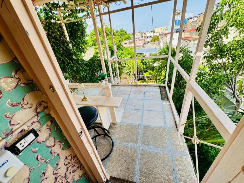 a view from the top of a balcony with a bench at La española in Santo Domingo