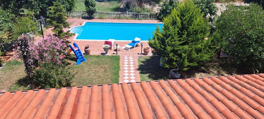an overhead view of a swimming pool on top of a roof at Pietra Mare Suites Villa in Palaión Eleftherochórion