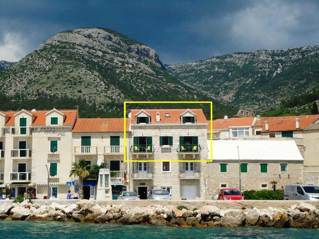 a group of buildings in front of a mountain at Apartment Allure in Bol