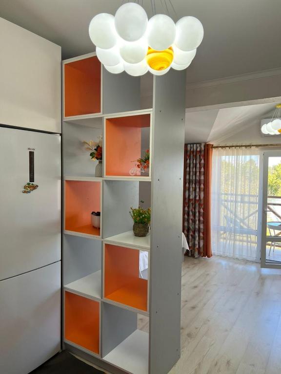 a room with a book shelf and a ceiling at Квартира in Koshkolʼ