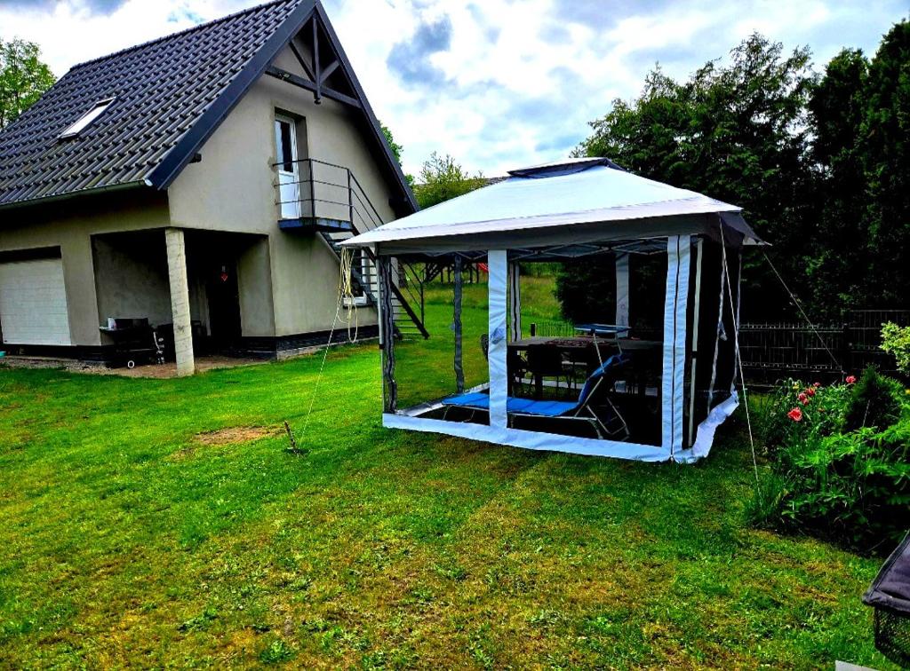 a gazebo in the yard of a house at Apartament Babina Loft in Żarkie Małe