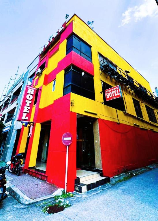 a brightly colored building with a stop sign in front at New Wave Damansara Damai in Petaling Jaya