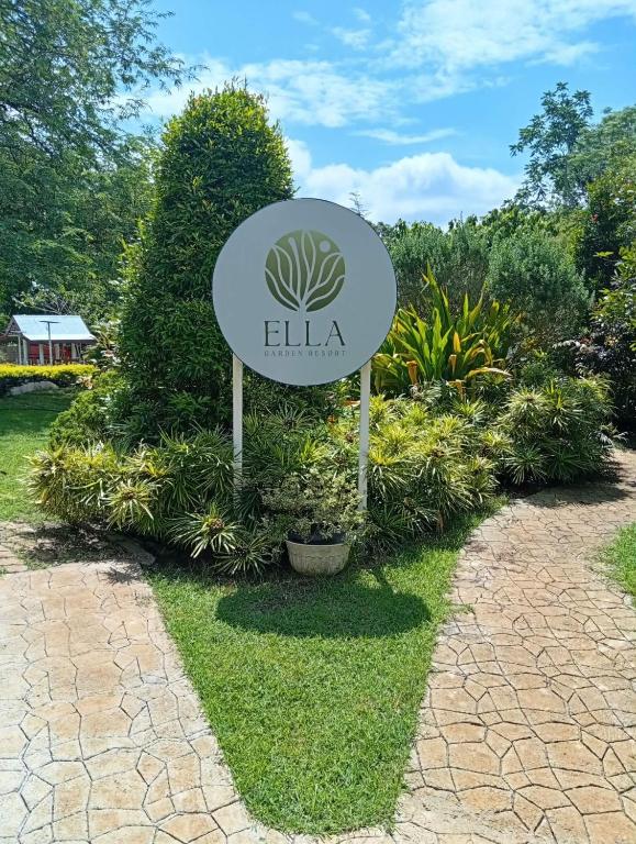 a sign for the elia sign in a garden at Ella Garden Resort in Mag-ag