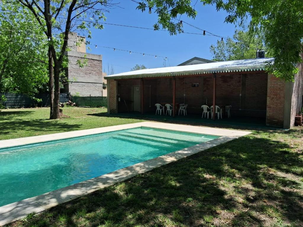 a swimming pool in the yard of a house at La Morada en Funes in Funes