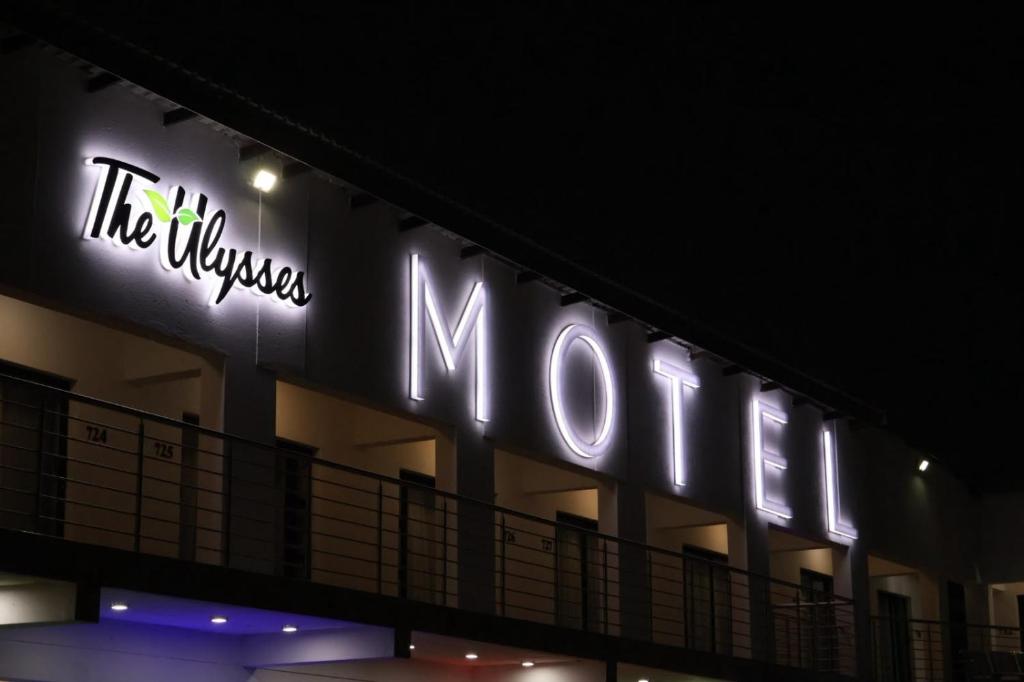 a neon sign on the side of a building at The Ulysses Motel in Ga-Mothiba