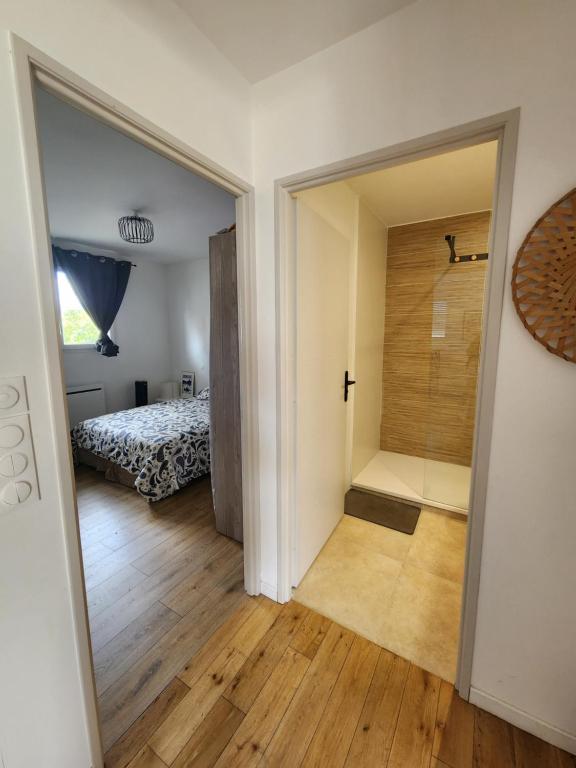 a room with a door leading to a bedroom at Chambre chez Rena in Saint-Jean-de-Luz