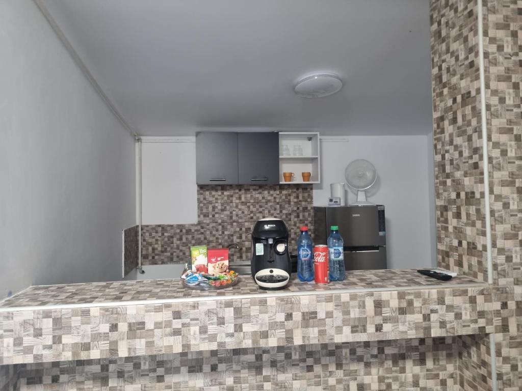 a kitchen counter with a coffee maker on it at Danove geocom in Făgăraş