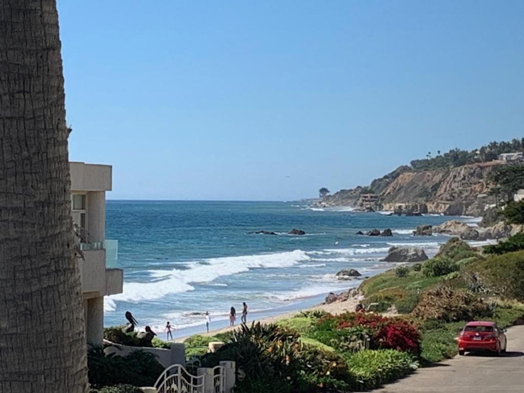 a view of the beach from a building at Malibu Surf Cottage on Lechuza Beach in Malibu