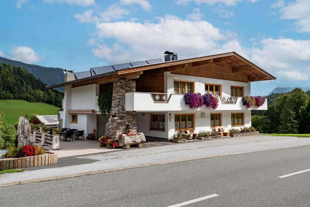 a house on the side of a road at Haus Enzian in Thiersee