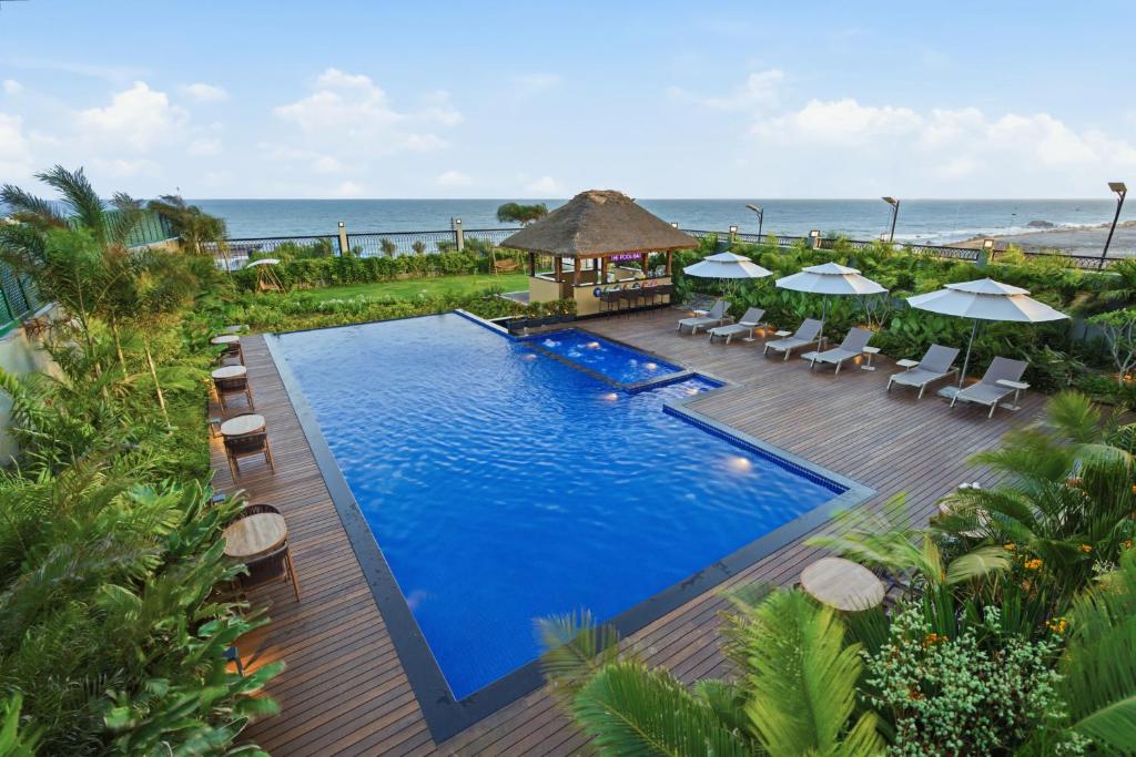 an overhead view of a swimming pool at a resort at Amaari Beach Resort in Kanyakumari