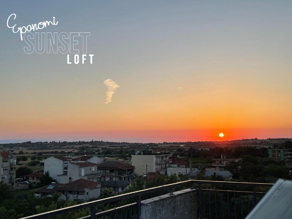 a sunset from the roof of a building at Epanomi SunSet Loft in Epanomi