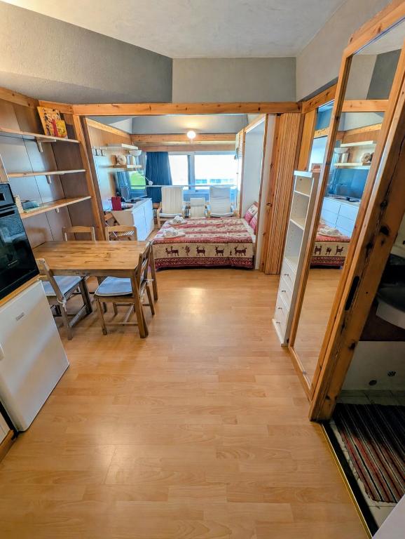 a room with a table and bunk beds at "FamilyNest" by Staymarilleva1400 in Marilleva