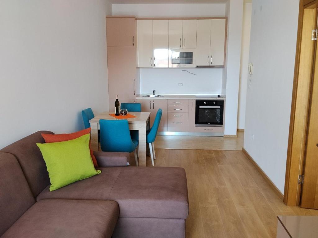 a living room with a couch and a table at Apartman Vesna in Budva