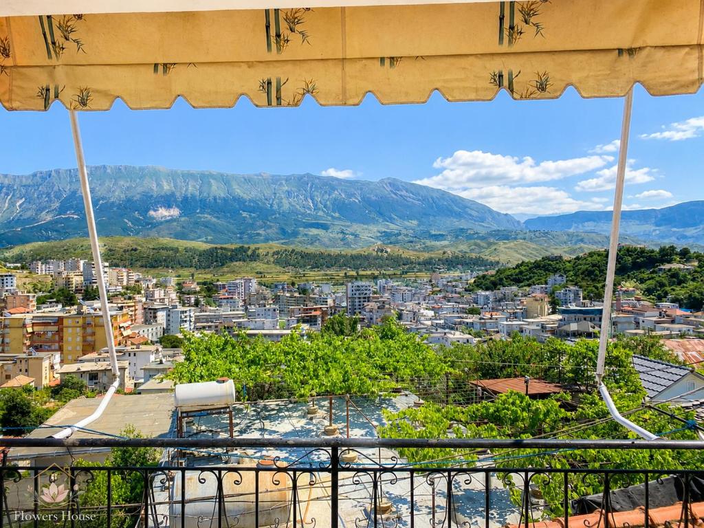 a view of a city from a balcony at Flowers House in Gjirokastër
