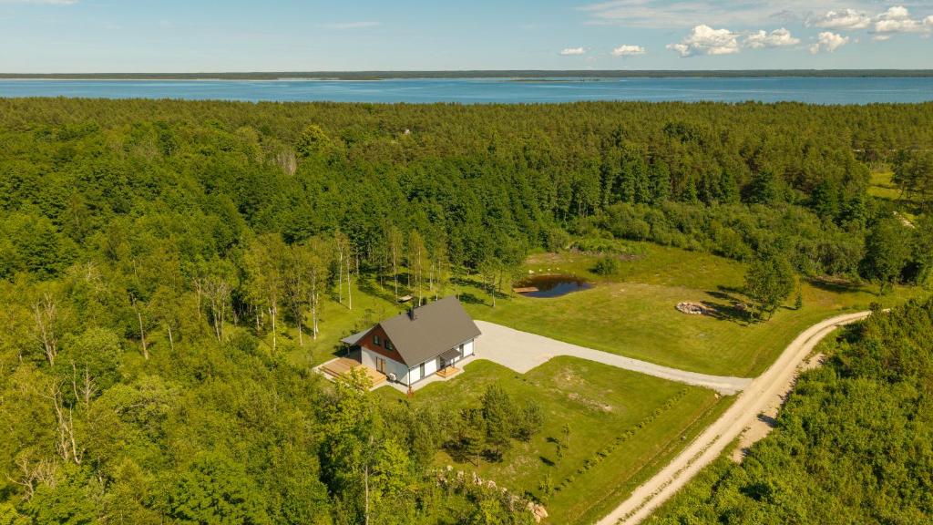 an aerial view of a house in the middle of a forest at Ninase Villa in Ninaze