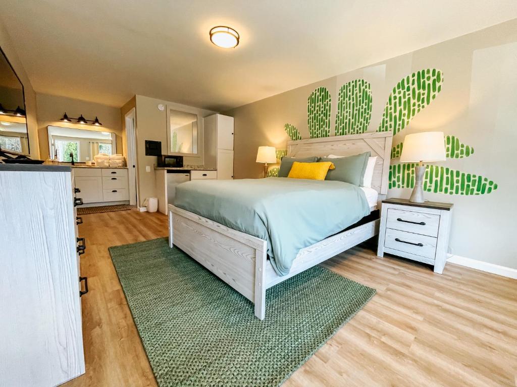 a bedroom with a bed and a green rug at Meadow Room at The Trailblazer Unit 12 in Townsend