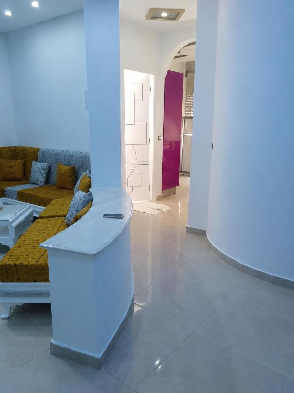 a living room with a couch and a table at ben mesaaoud in Kelibia