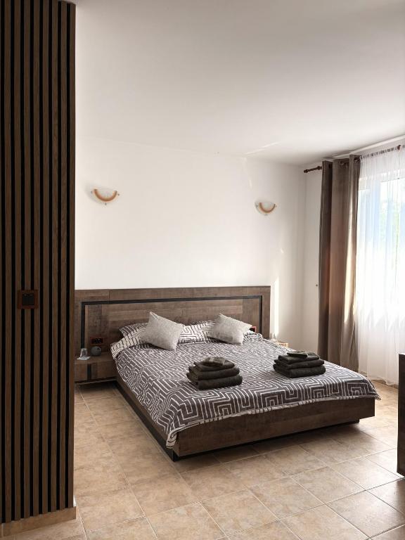 a bedroom with a large bed in a room at Casa Di Pafcho - Balchik Villa Retreat in Balchik