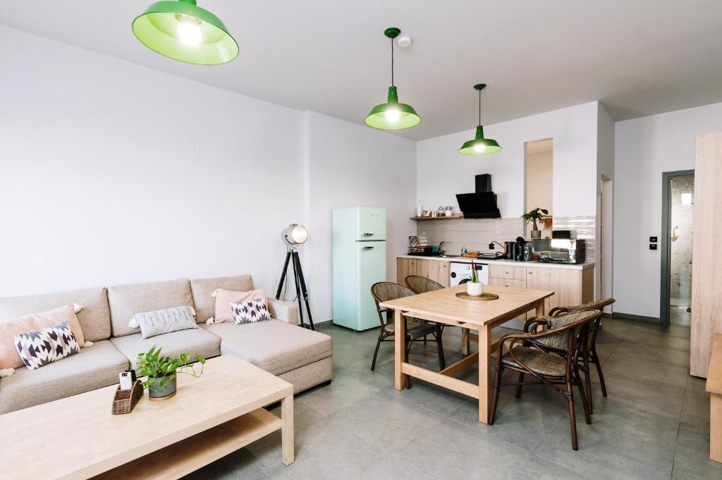 a living room with a couch and a table at Nomad apartment in Chóra