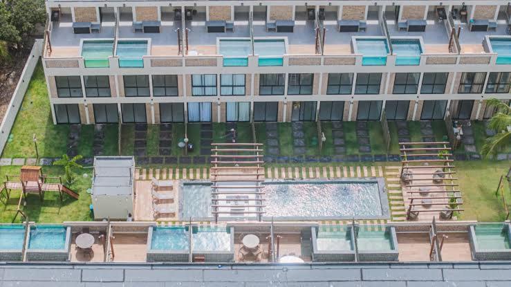 an aerial view of a building with a swimming pool at Atins Ville Lençóis in Atins