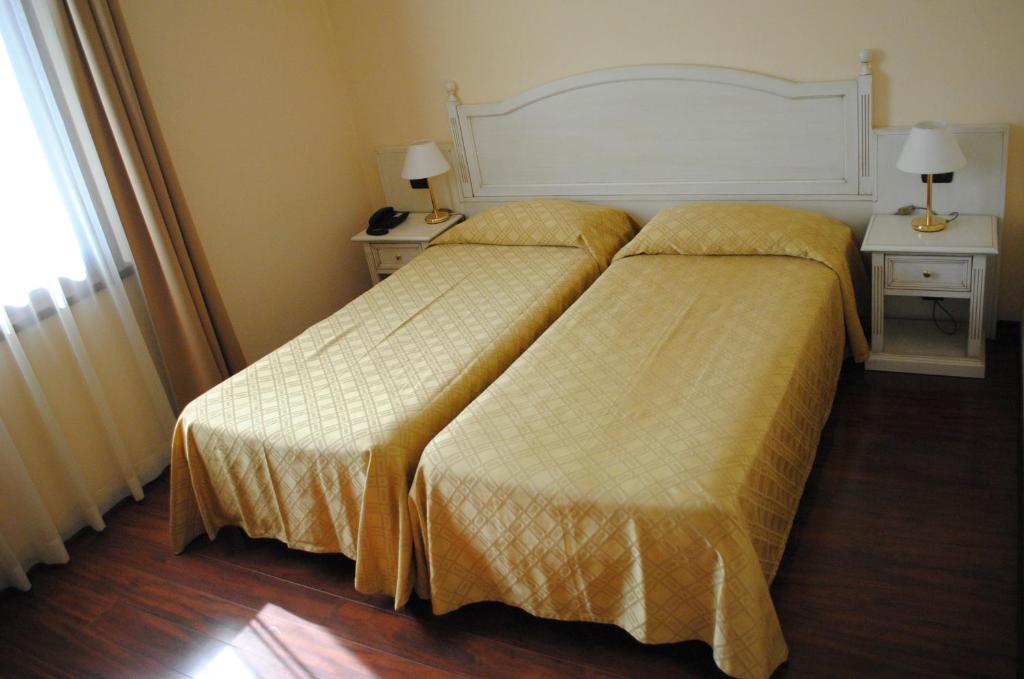 Postel nebo postele na pokoji v ubytování International Hotel