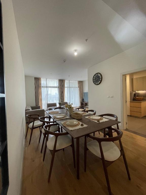 a dining room with a table and chairs at Luxury Apt l La Gare in Addis Ababa