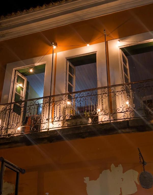 a balcony of a building with lights on it at Casaraosete7 in Salvador