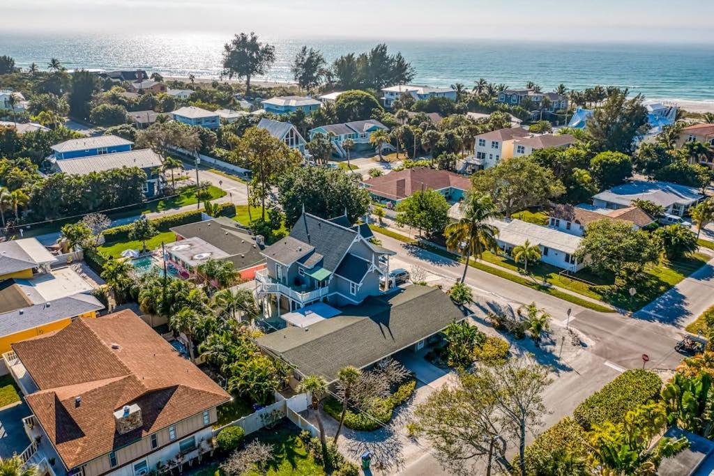 an aerial view of a neighborhood with houses and the ocean at Mint Green Getaway in Holmes Beach