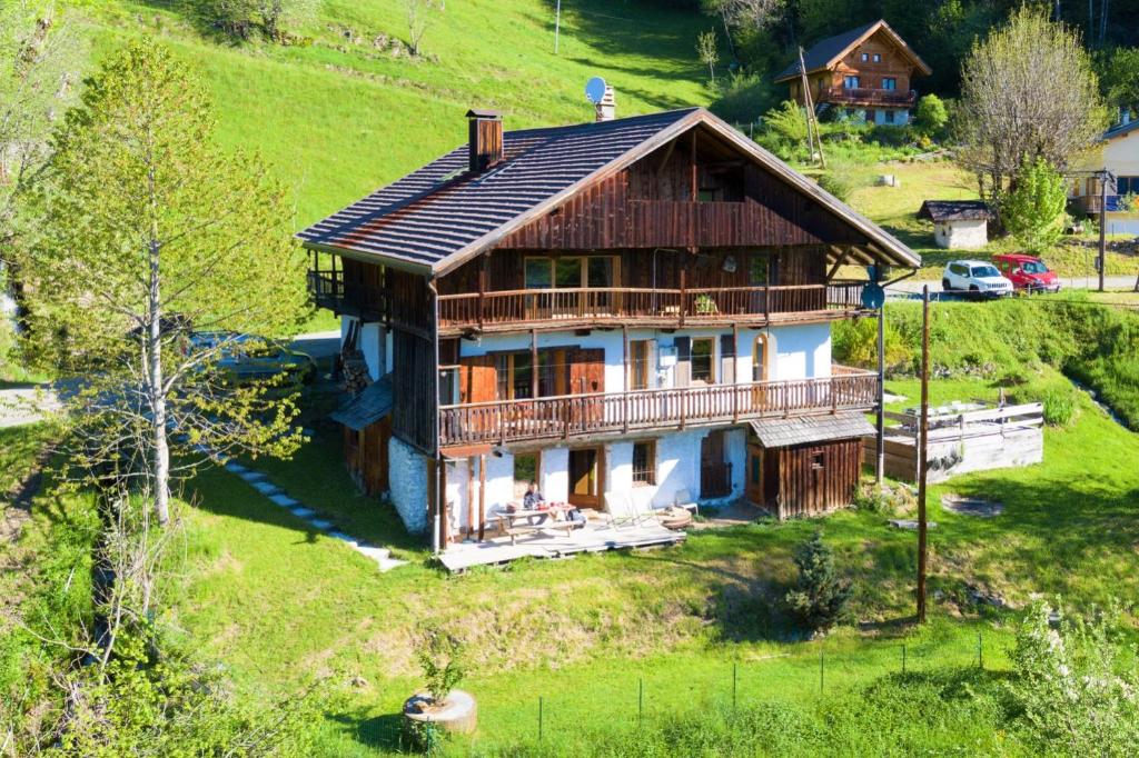 a large house on a hill with at Le Moulin de Bisanne in Villard-sur-Doron