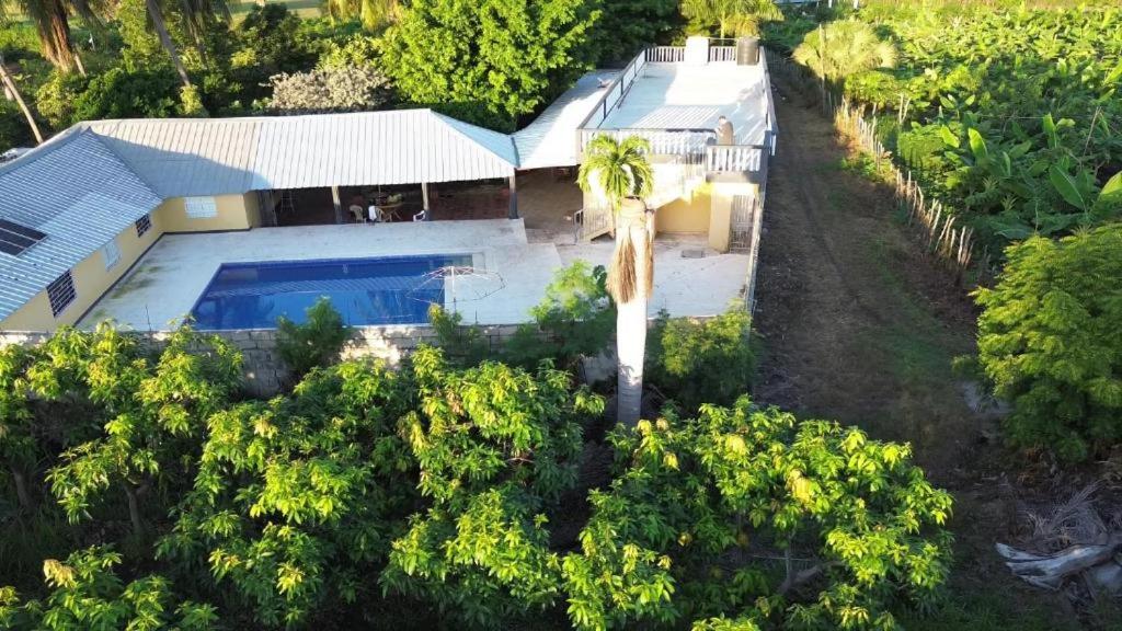an overhead view of a house with a swimming pool at Apartamento Finca Verde in Las Carreras