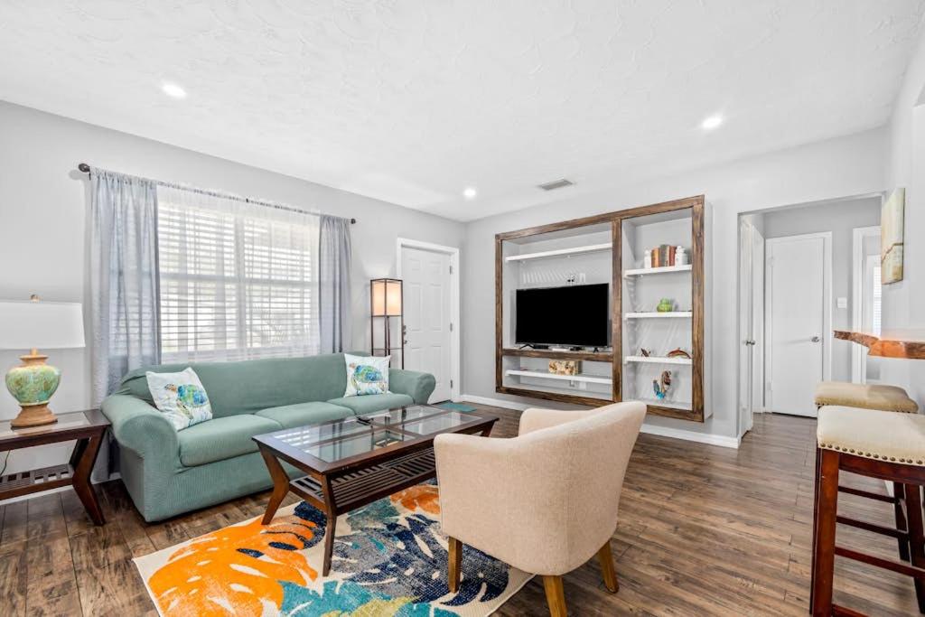 a living room with a couch and a table at Don't Be Koi in Bradenton