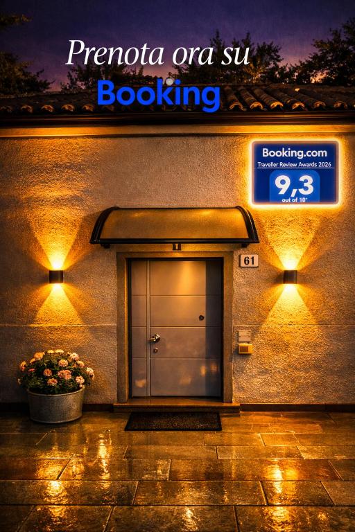 a door to a building with a sign on it at Lary&Giù in Cadelbosco di Sopra