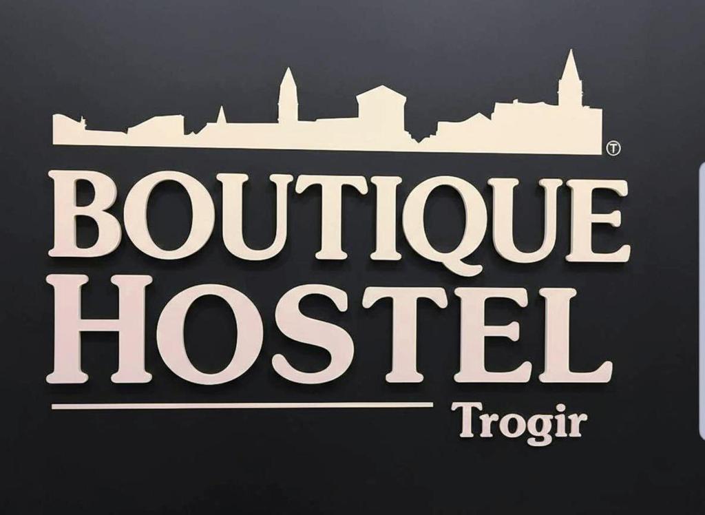 a sign with the words boutique hostel at Boutique Central Square Hostel in Trogir