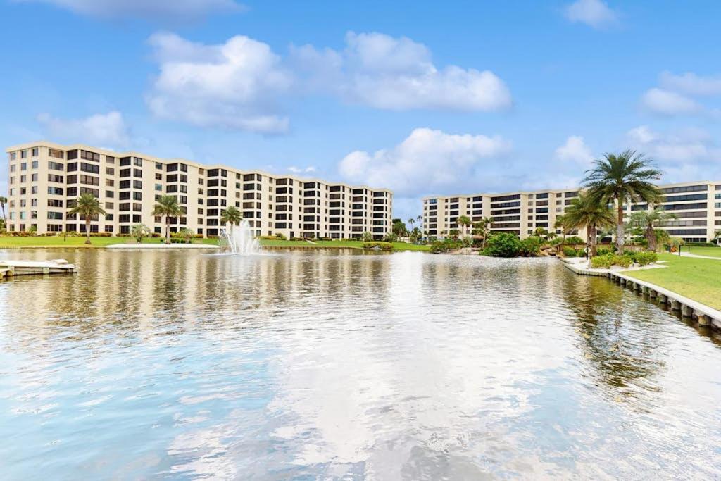 a large pond in front of a large building at The Aquarium in Sarasota