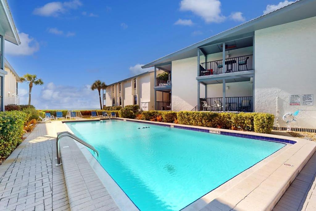 a swimming pool in front of a building at Gulf Place 20 in Holmes Beach
