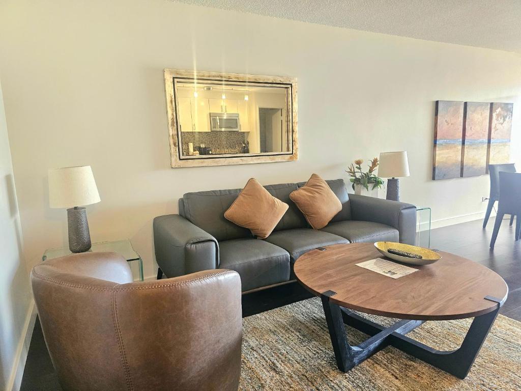 a living room with a couch and a table at Discovery Bay 3517 in Honolulu